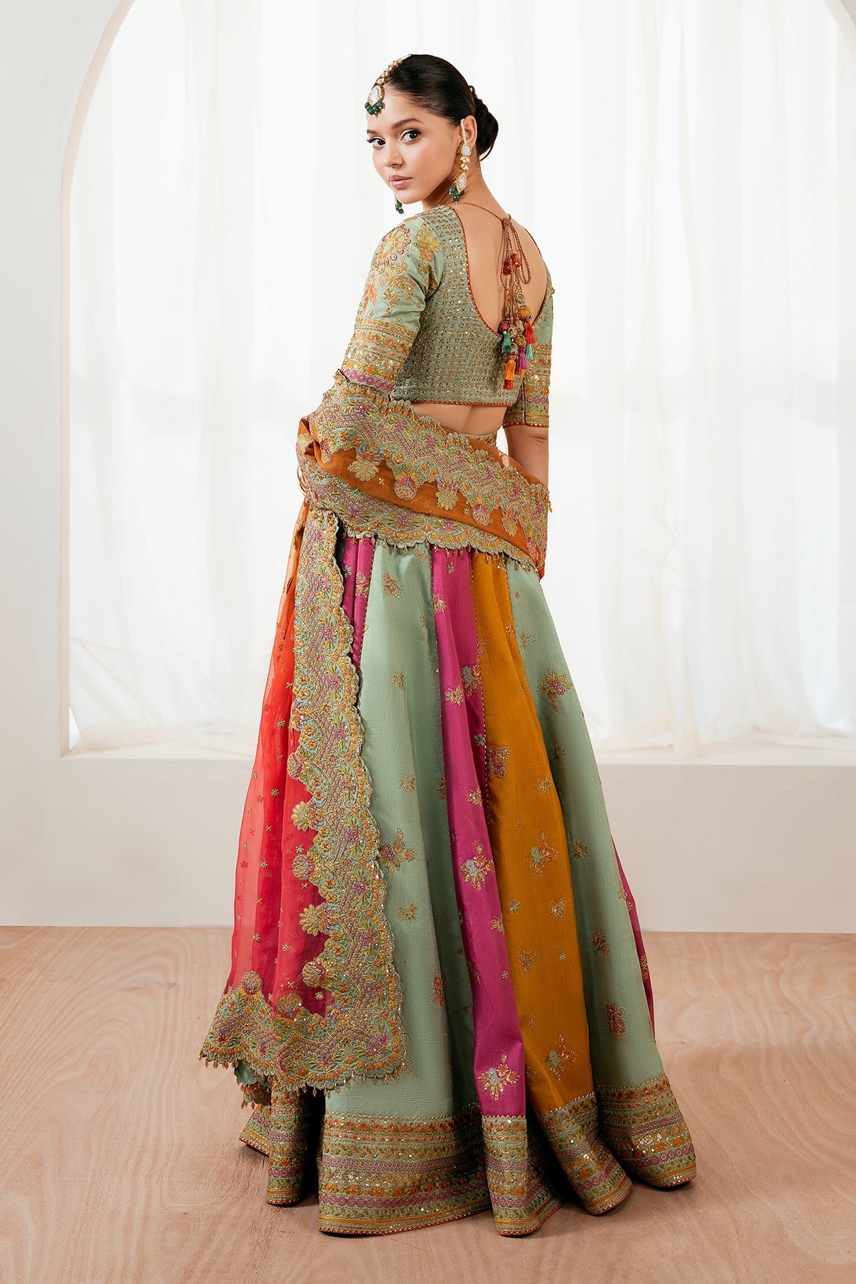 Embroidered silk lehenga set back view showing blouse and skirt