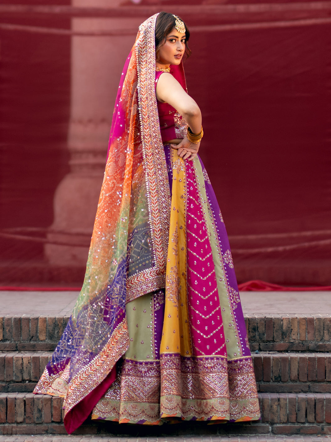 Mala lehenga set side view showing dupatta drape and skirt border