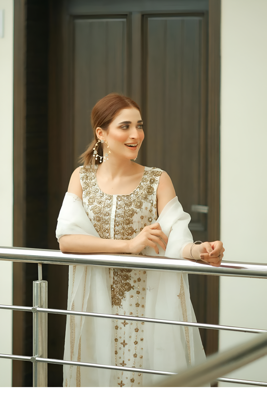 Tassel Silk style ivory and gold formal outfit, alternate railing pose