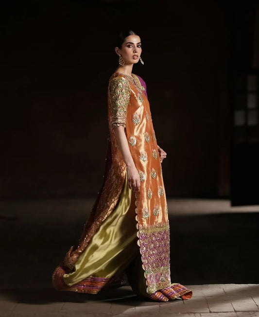 Copper Bloom, made by MAIRAZ — side view showing the long shirt silhouette, green trousers and striped trouser hem