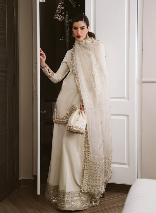 Ivory, made by MAIRAZ — full-length angled view with the embellished dupatta draped across the outfit