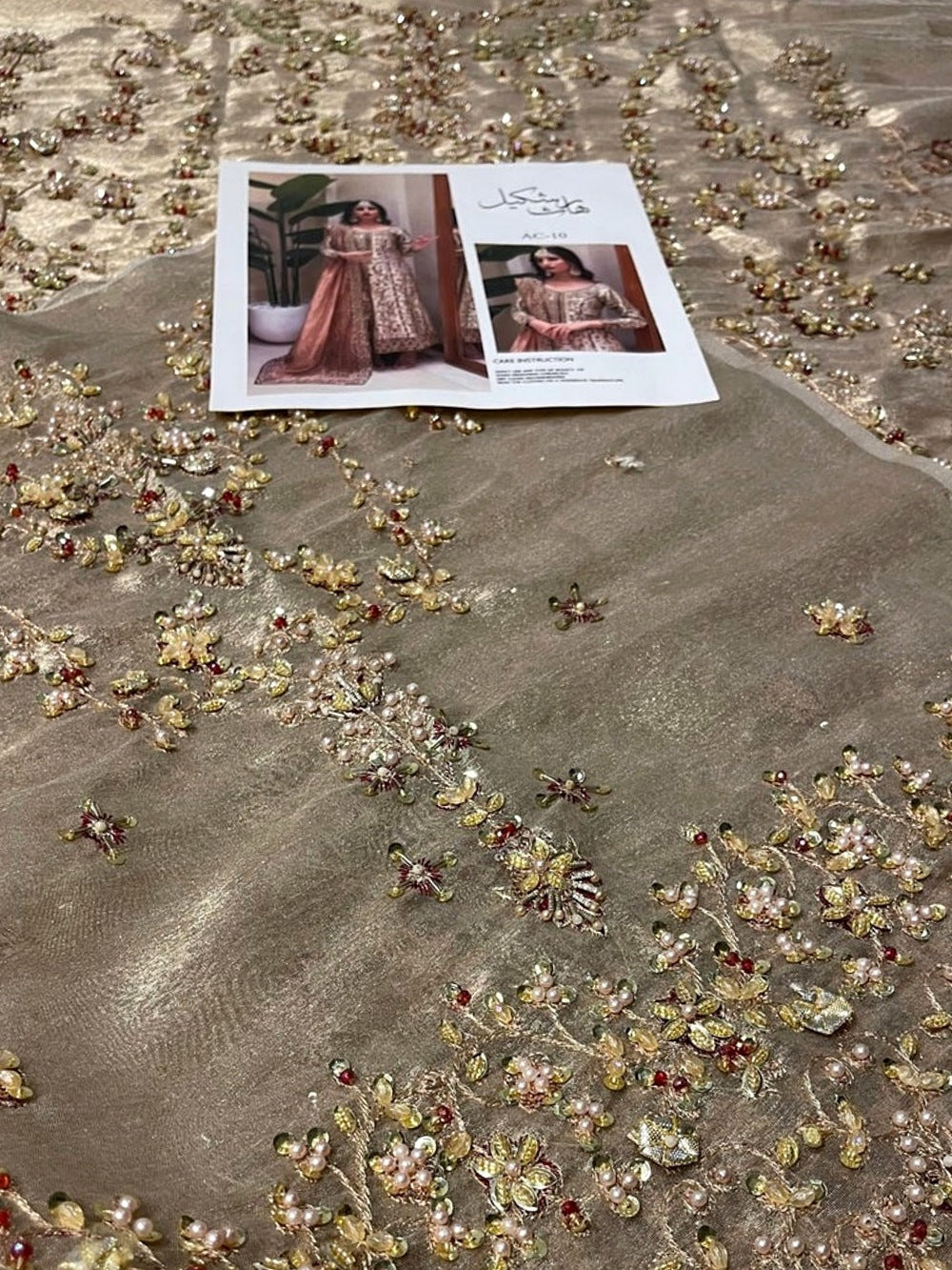 Dilruba Style blush dupatta and ivory gold hand embellished fabric close-up