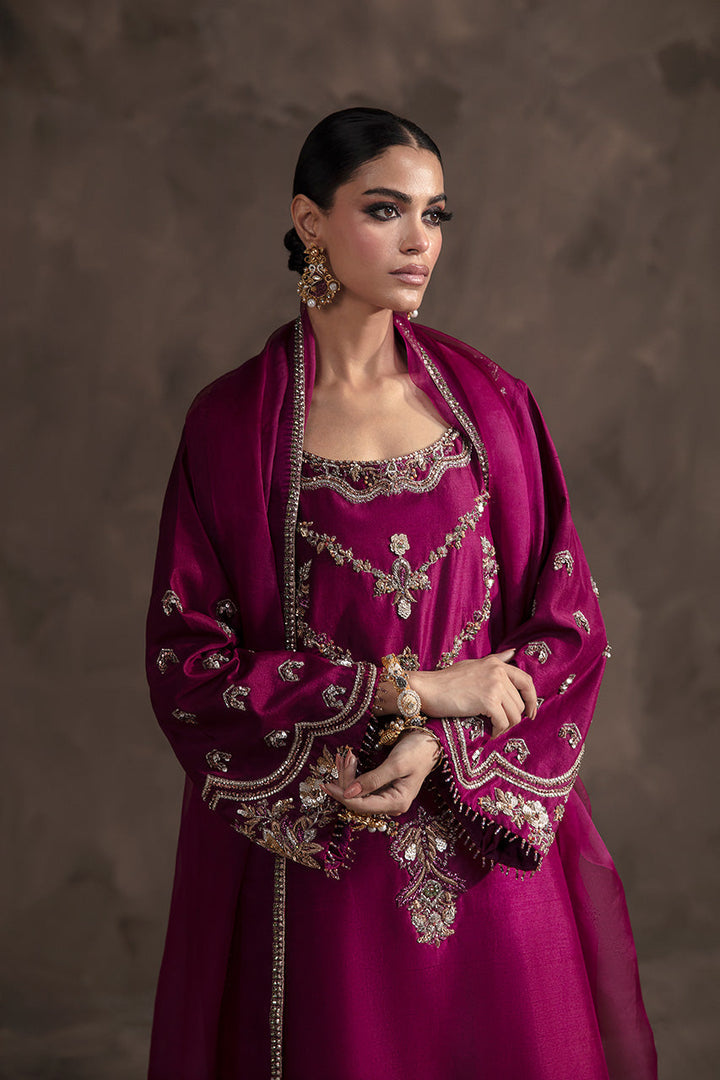 Eliana magenta silk outfit with embroidered dupatta draped over shoulder