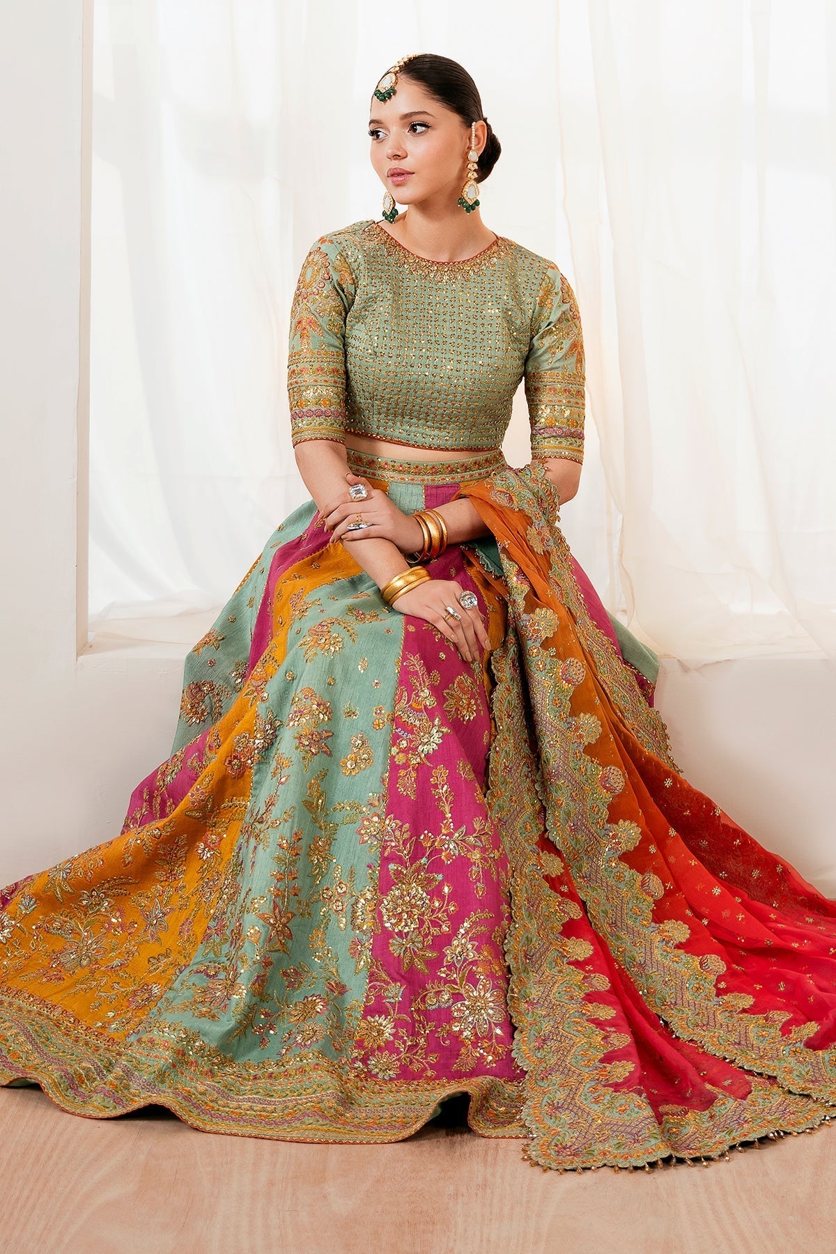 Embroidered silk lehenga set front view showing multicolour skirt panels