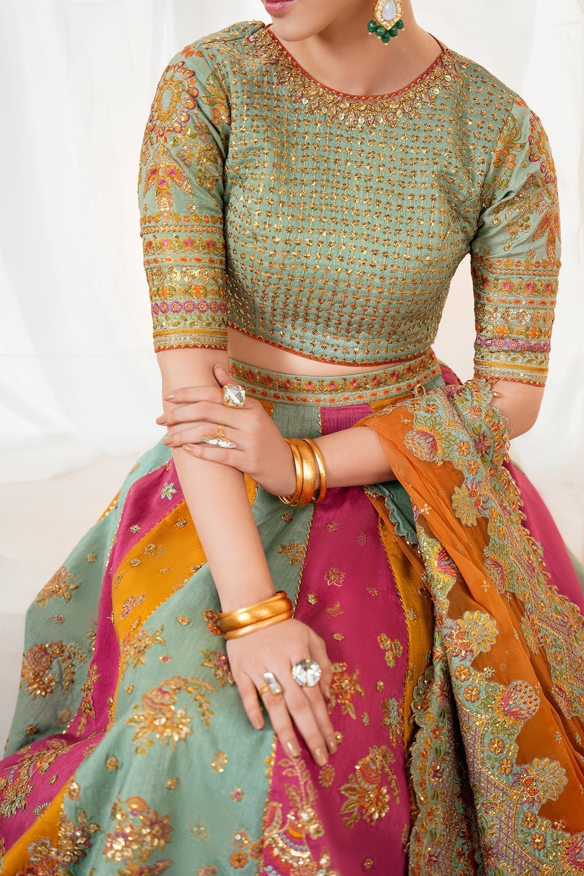Embroidered silk lehenga close-up of blouse hem and skirt embroidery