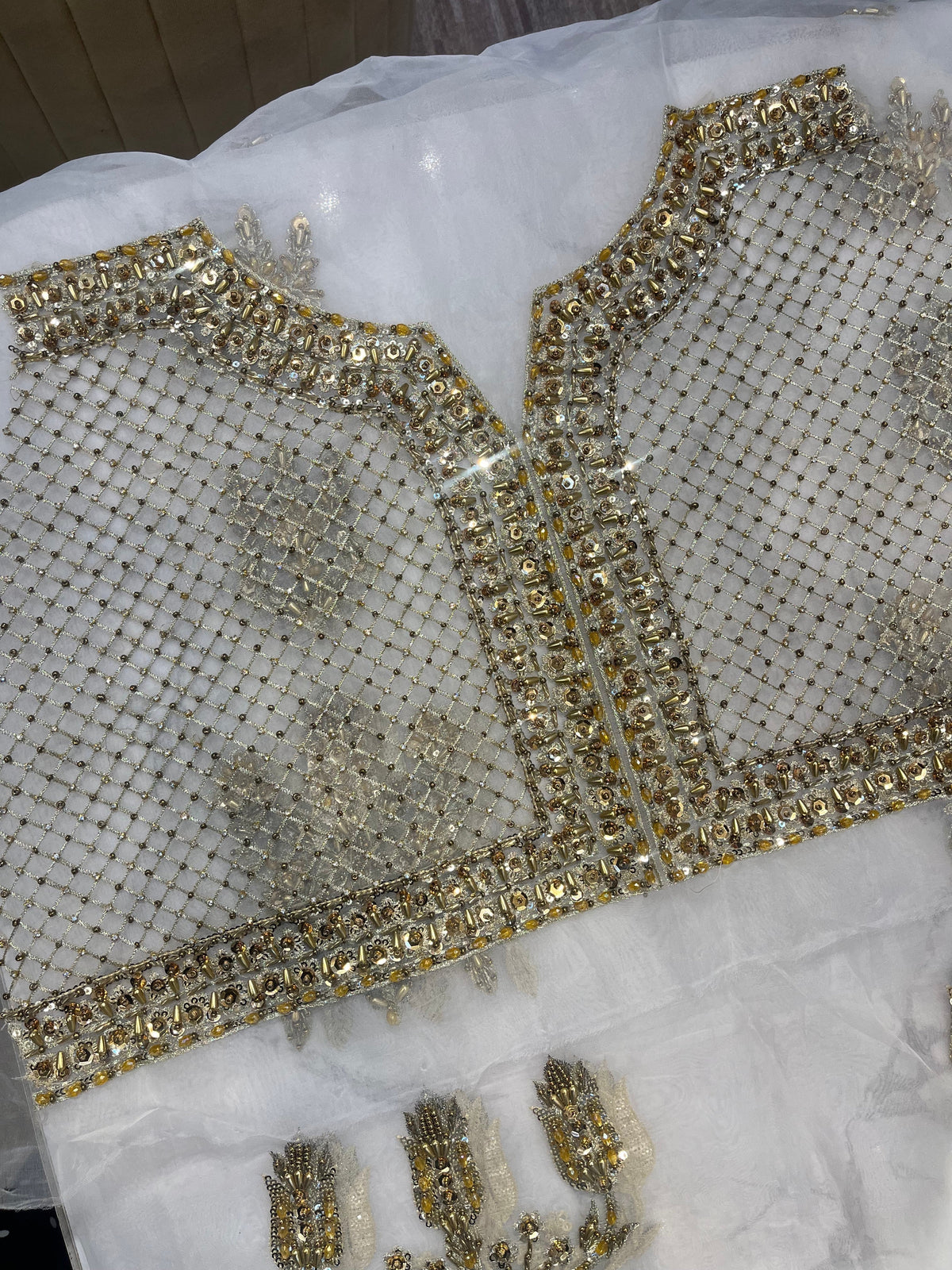 Hussain Rehar Saheda flat lay of embroidered shirt panel and border pieces