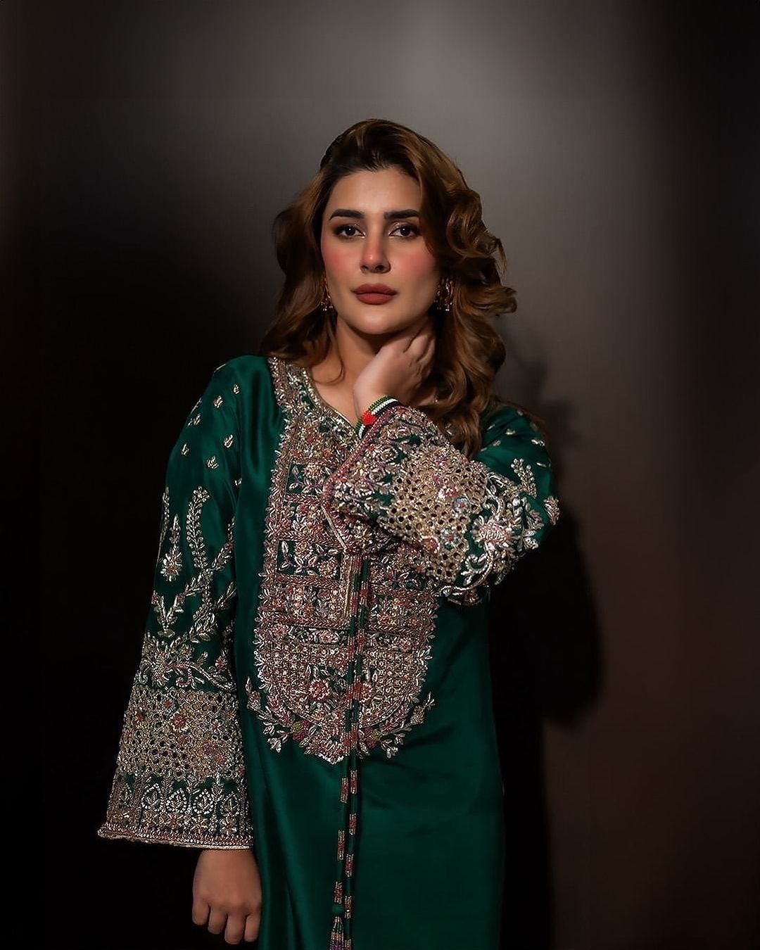 Kubra emerald green formal outfit front view showing embroidered centre panel