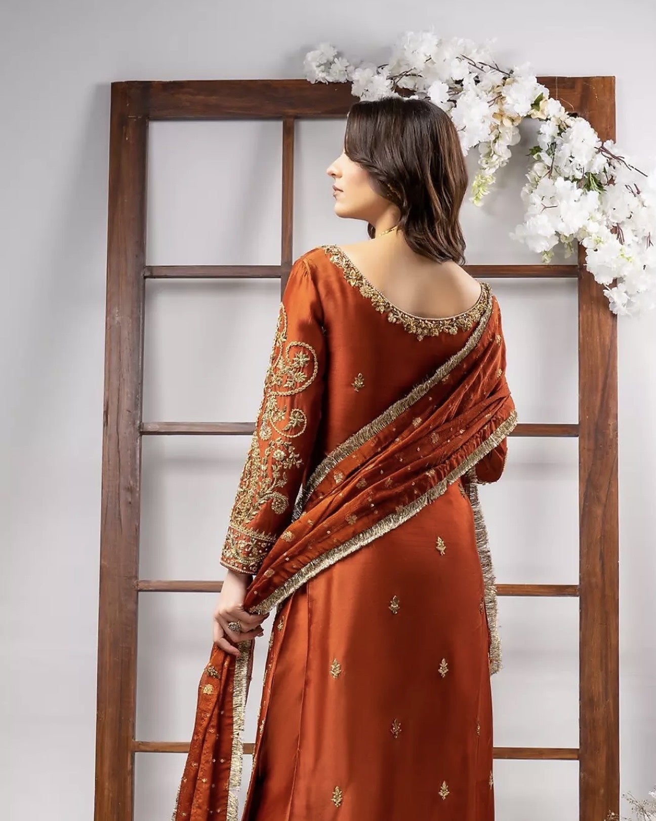 Ahmad Sultan Tangerine Style orange katan silk suit back embroidery and dupatta detail