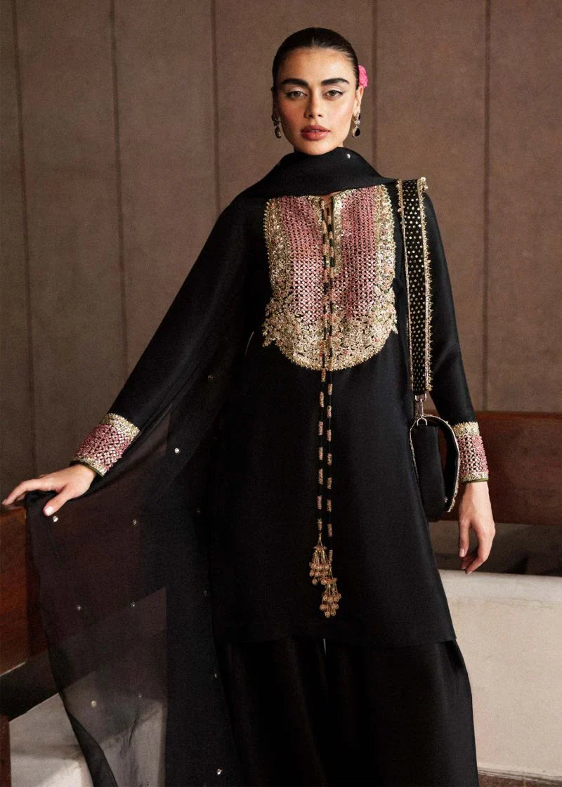 Char black formal outfit close-up of embroidered neckline and gold tassel detail
