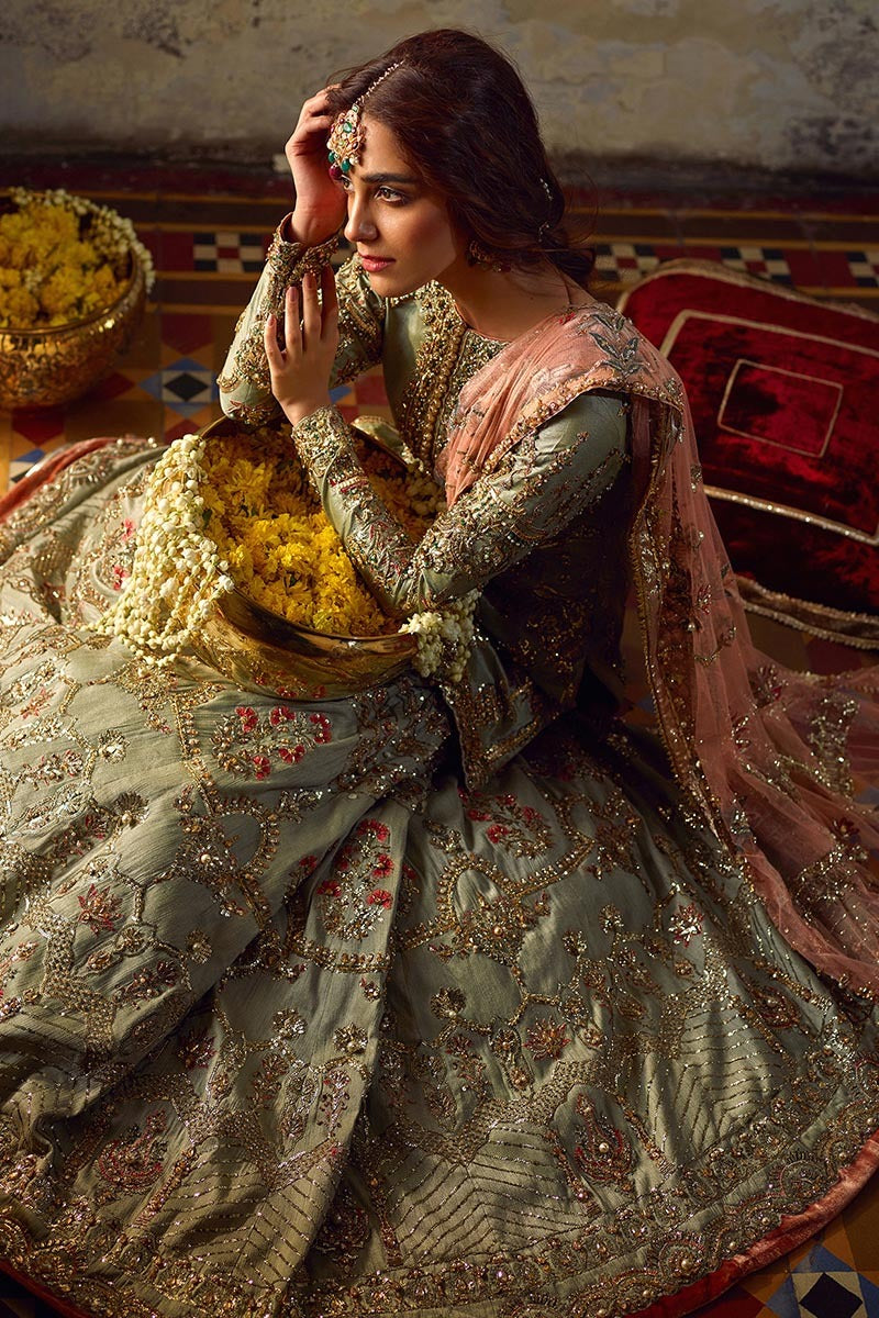 Gul-e-Zamurd seated view showing embroidered lehenga skirt detail