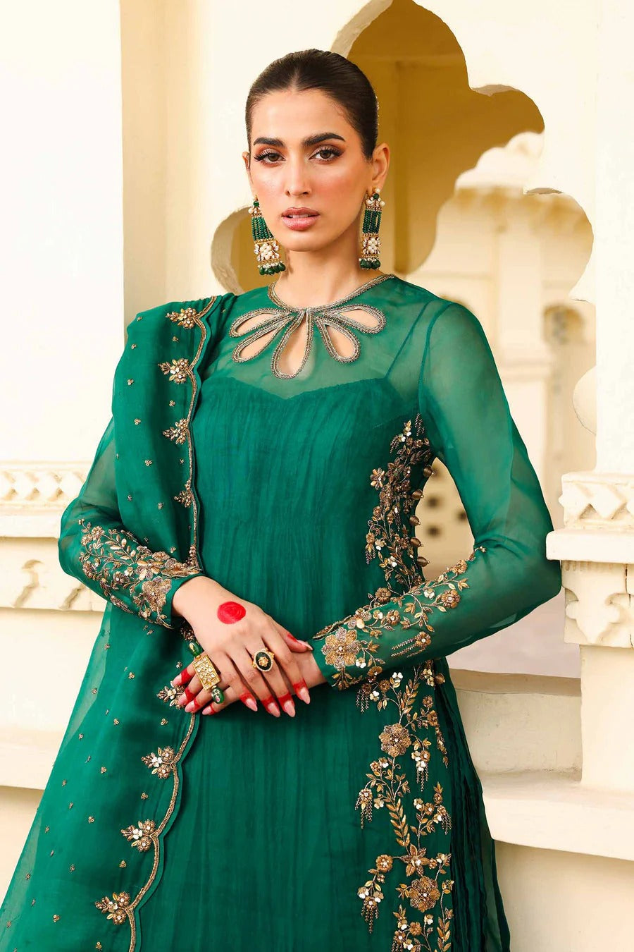 Noor-e-Sabz emerald green dress front view showing cut-out neckline embroidery