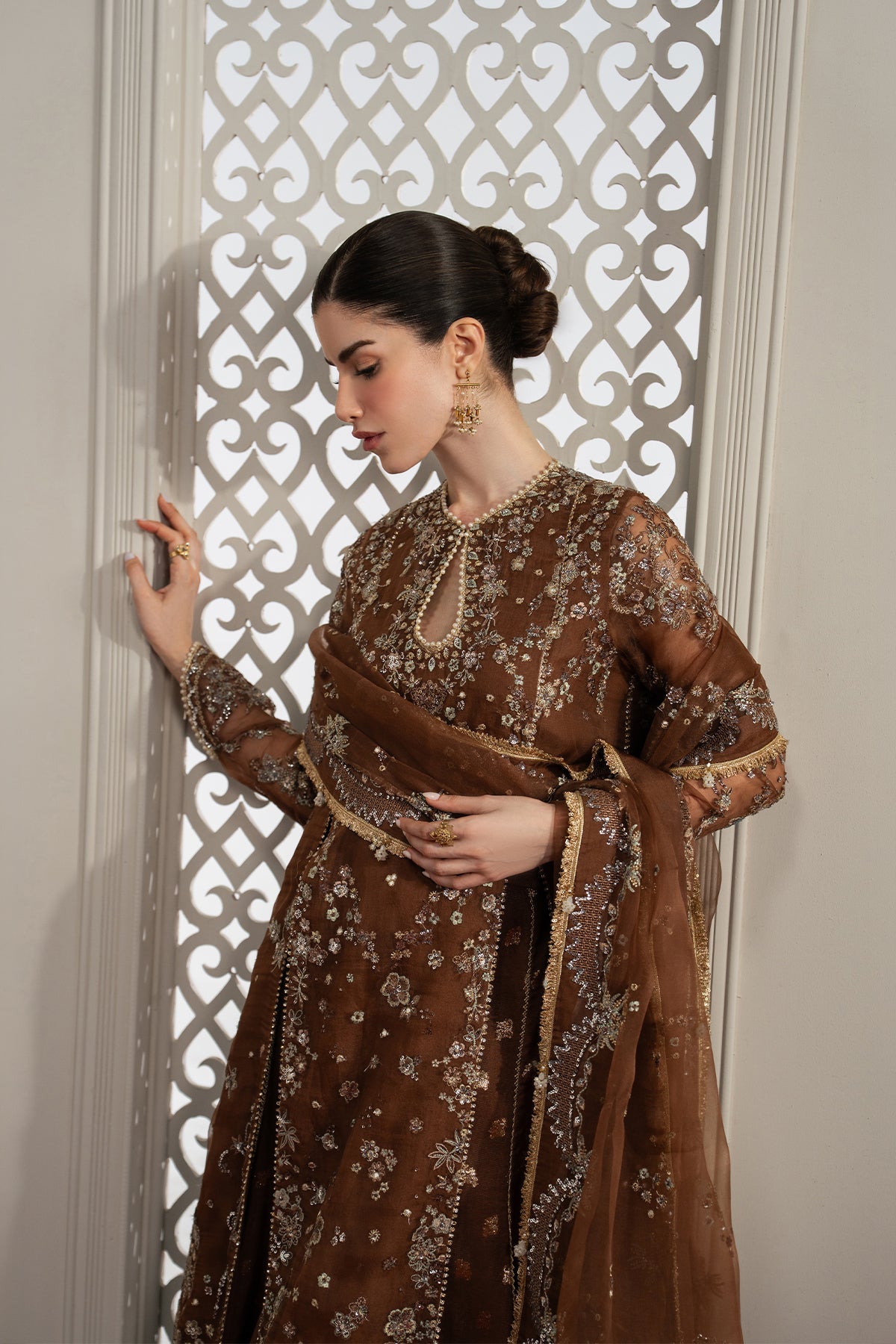 Isadora, made by MAIRAZ — dark brown lehenga suit, three-quarter upper-body view