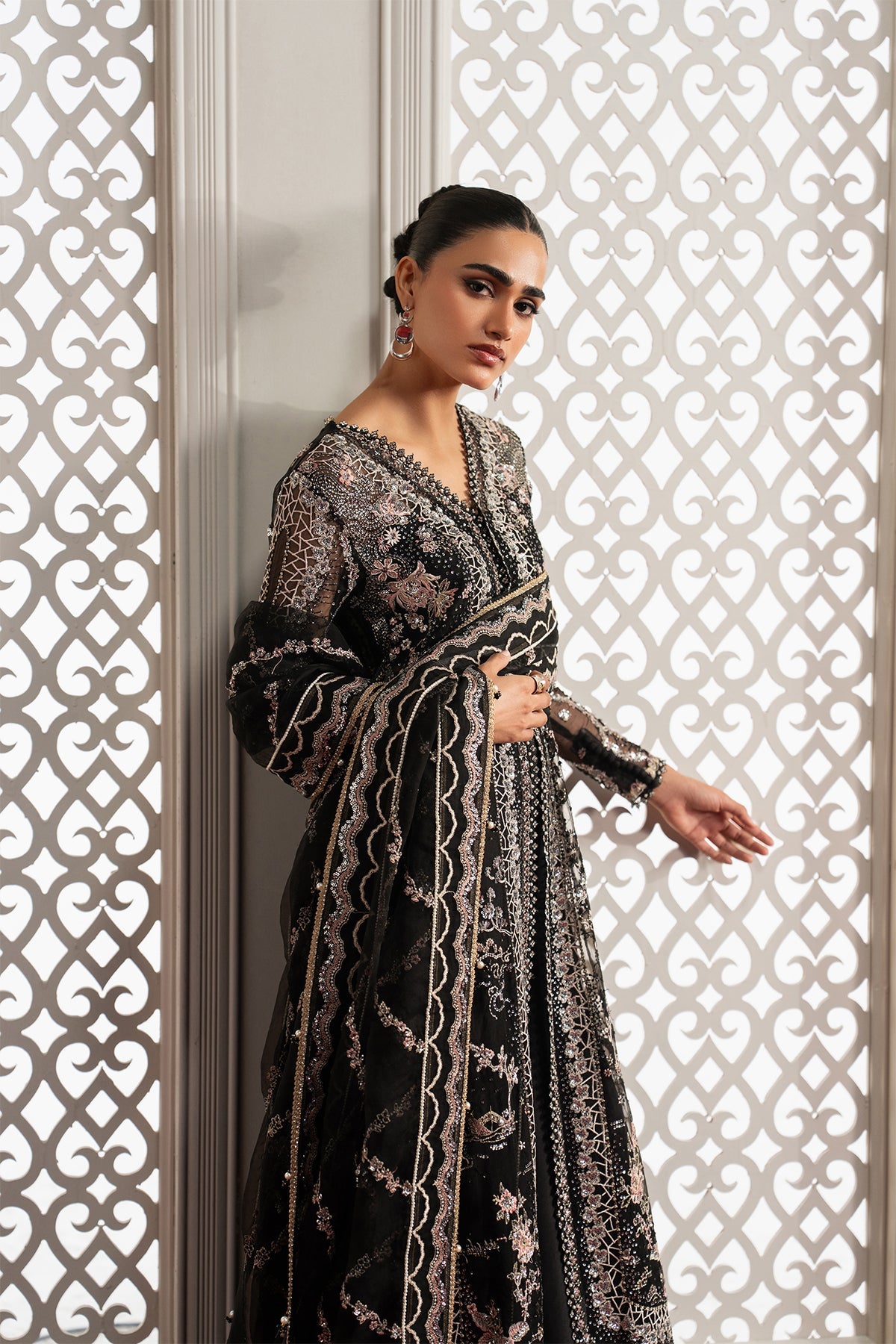 Magnifique, made by MAIRAZ — black sharara, three-quarter upper-body view