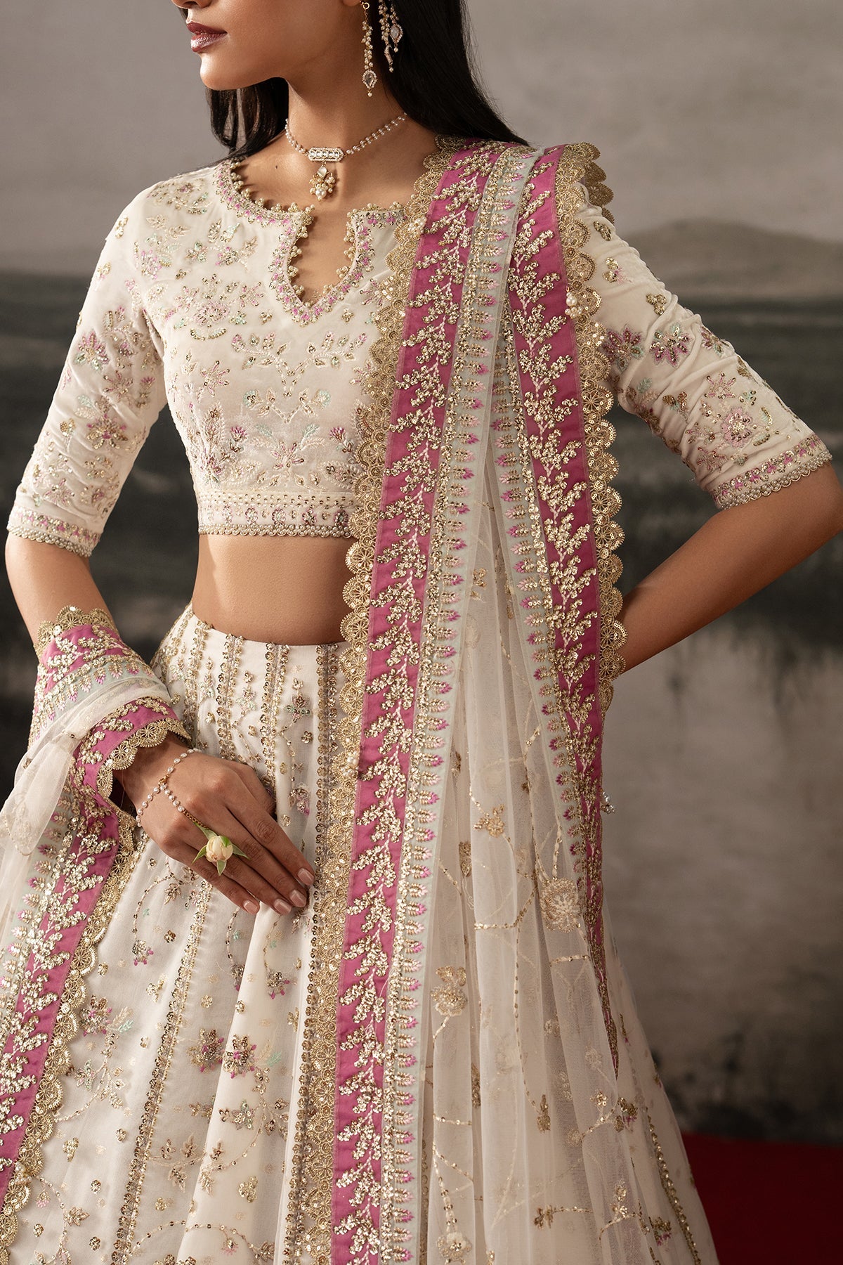 Parure, made by MAIRAZ — white with pink and green accents lehenga choli, bodice embroidery and dupatta border detail
