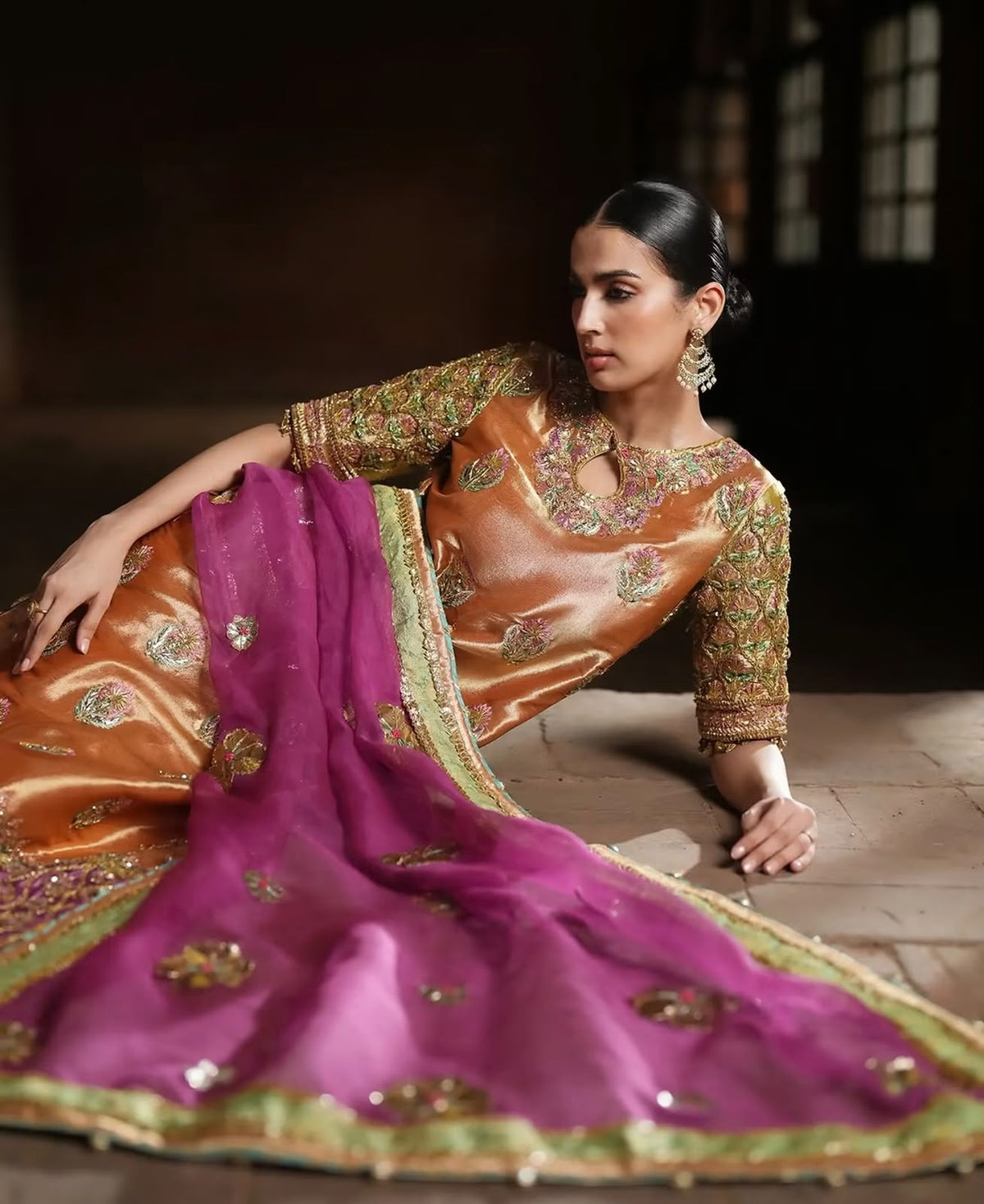 Copper Bloom, made by MAIRAZ — seated view showing the keyhole neckline and magenta dupatta with green border