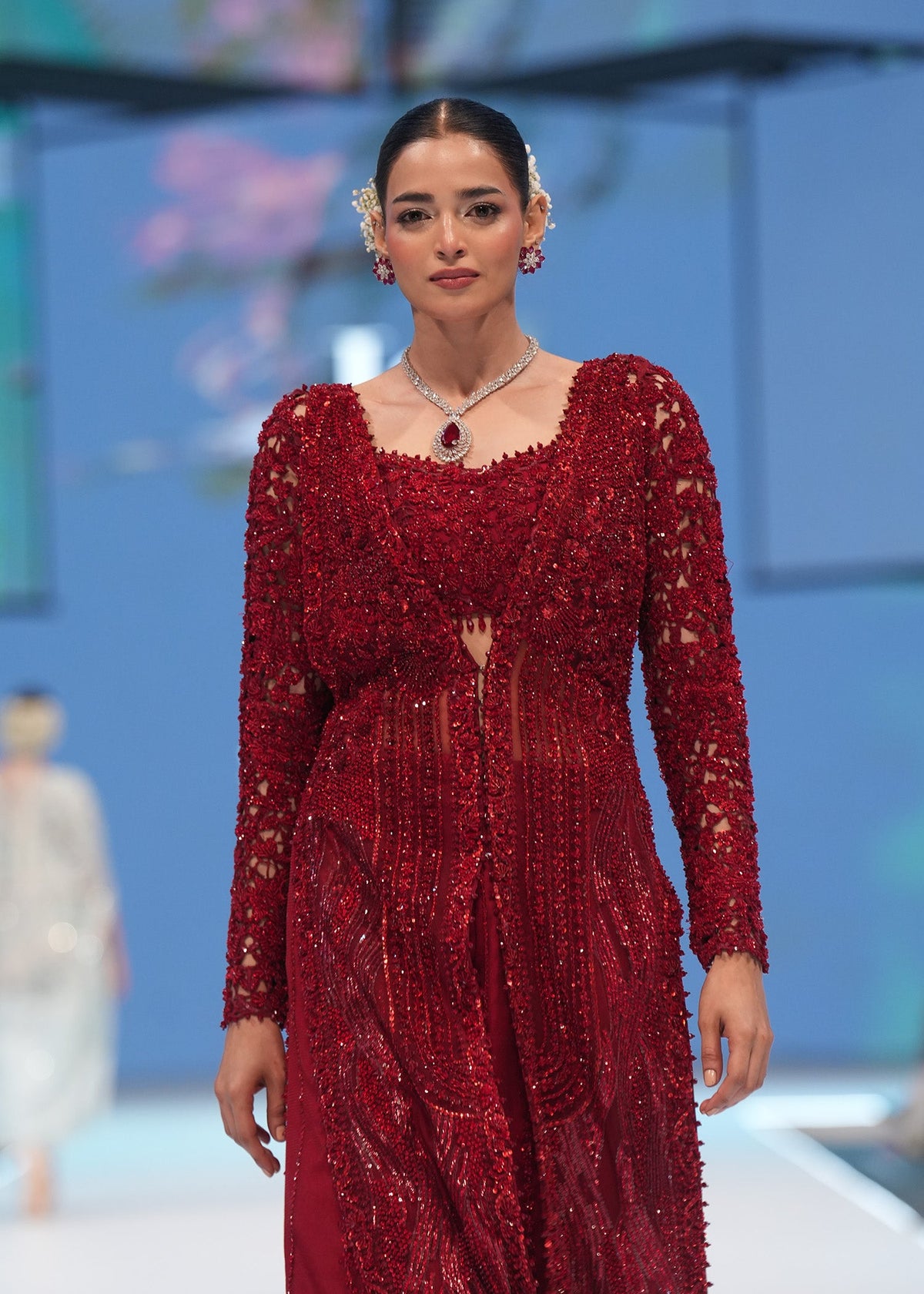 Crimson Desire, made by MAIRAZ — front detail showing the embellished cape and bustier