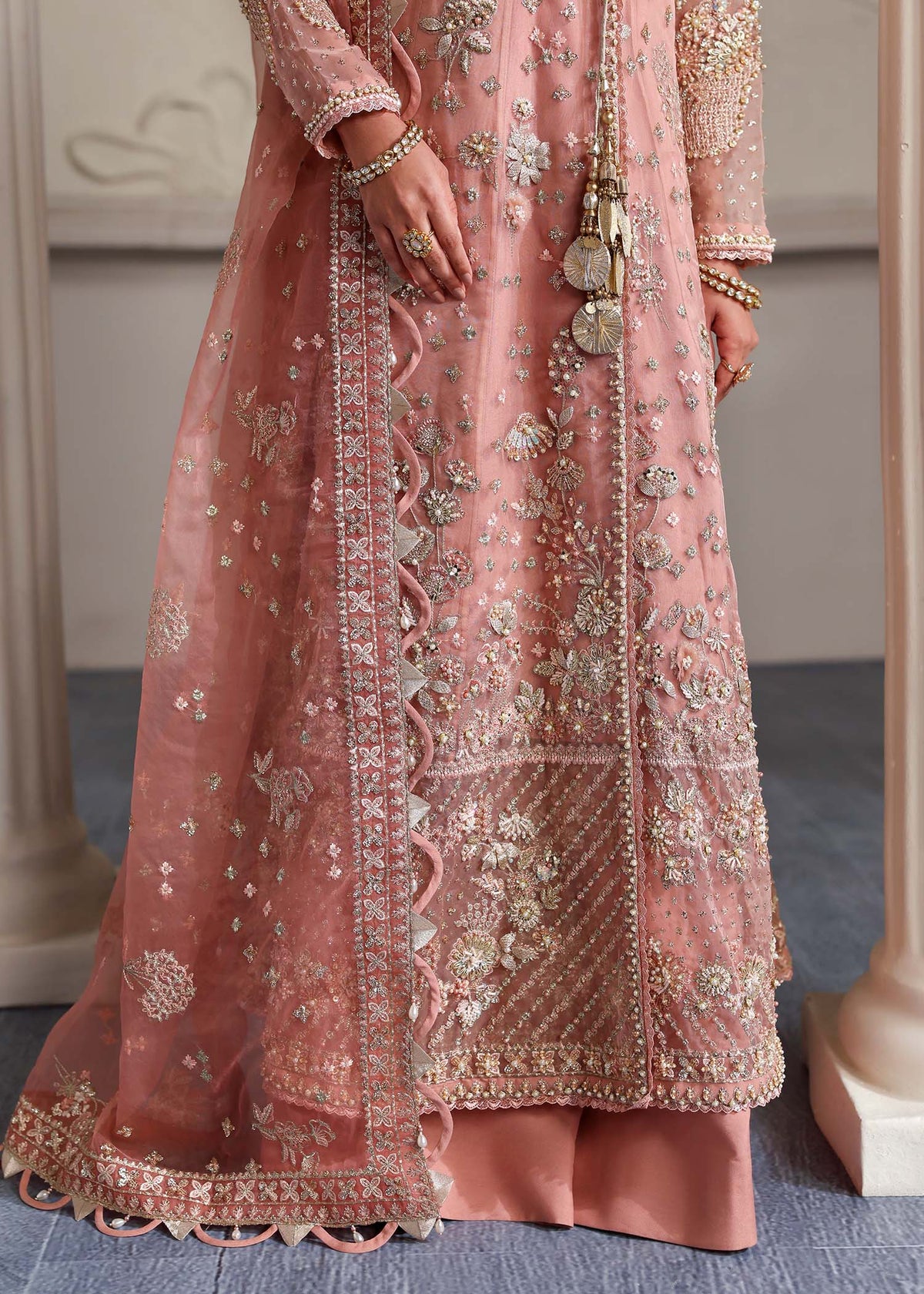 Elza, made by MAIRAZ — peach pink angrakha, front border and hem detail