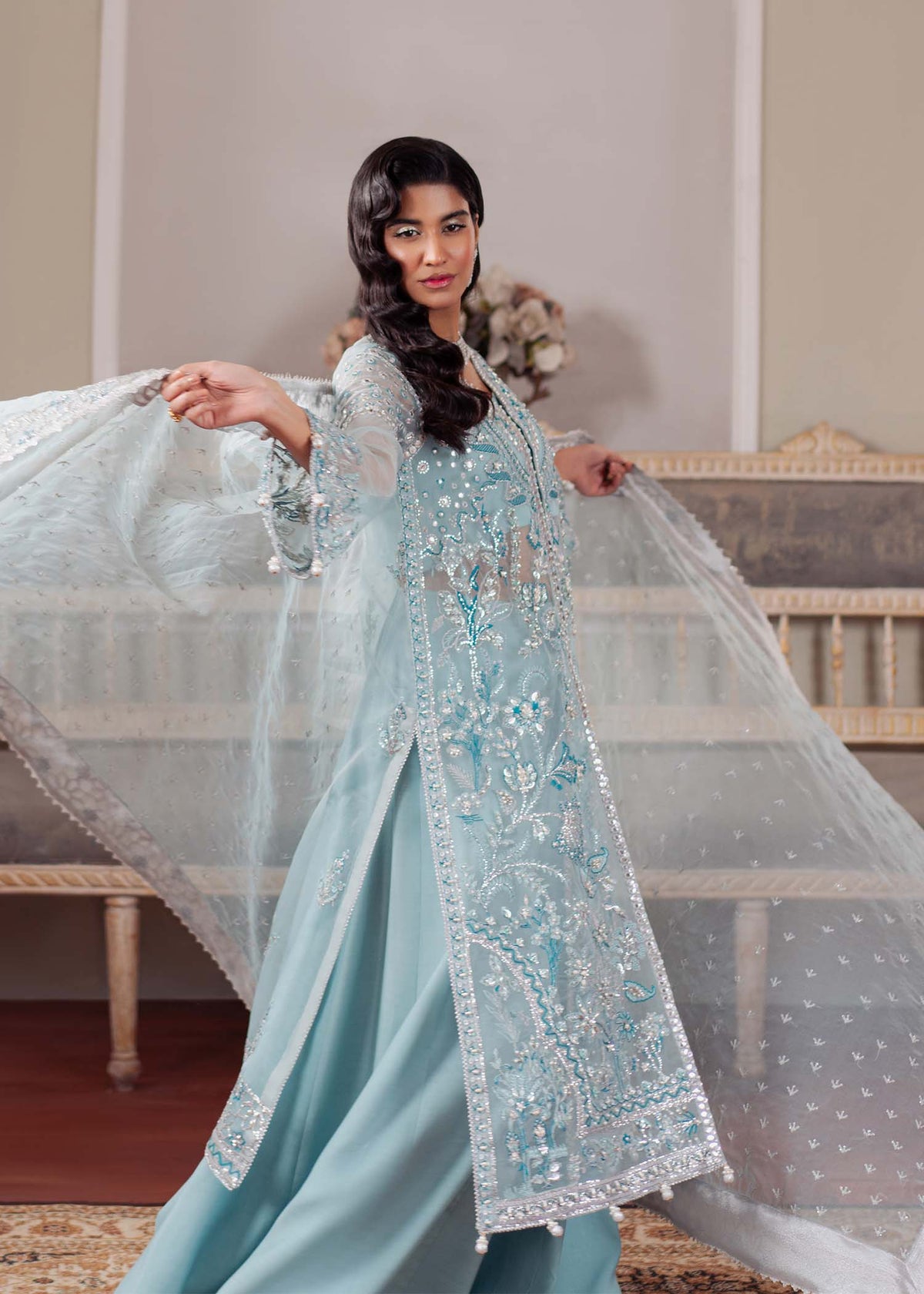 Starlight, made by MAIRAZ — ice blue long shirt, seated view showing trousers and dupatta