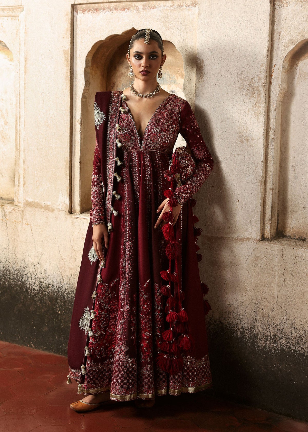 Gulnar, made by MAIRAZ — full-length front view of the burgundy and maroon pishwas with shawl