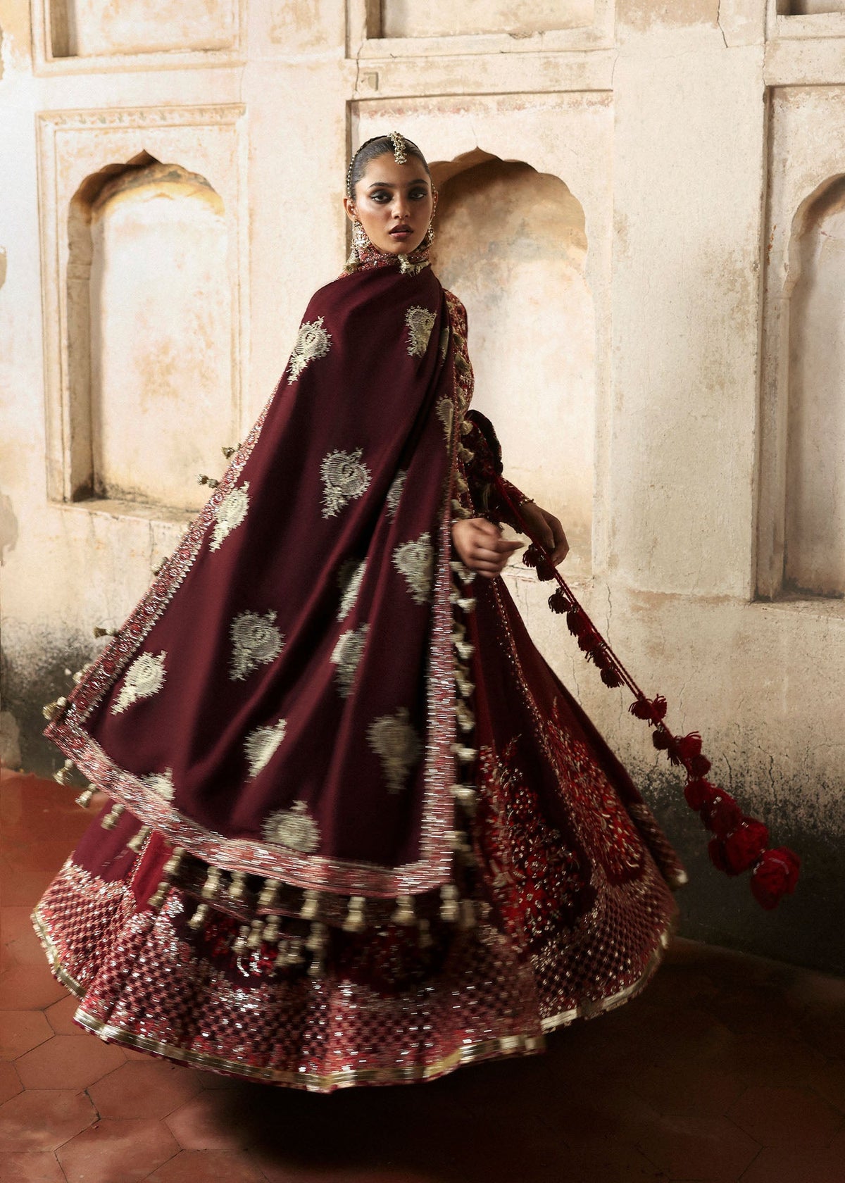 Gulnar, made by MAIRAZ — full-length movement view showing the embroidered shawl and flared skirt