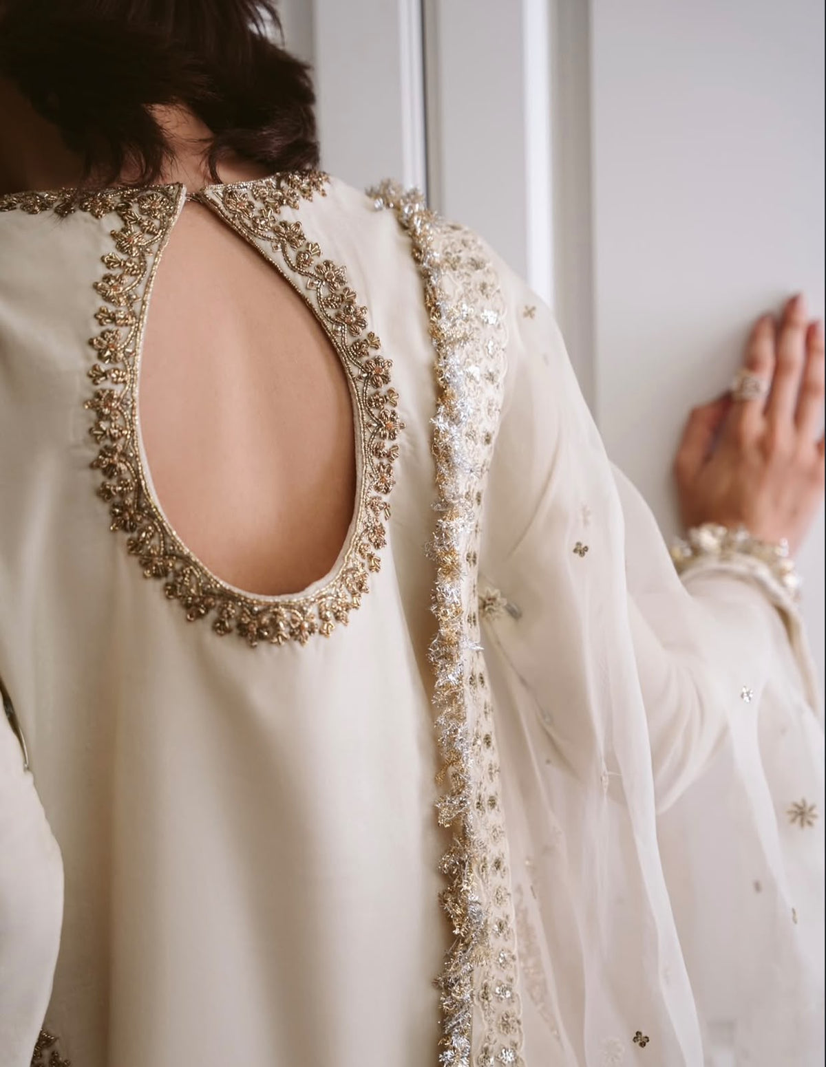 Ivory, made by MAIRAZ — close-up of the embellished keyhole back neckline