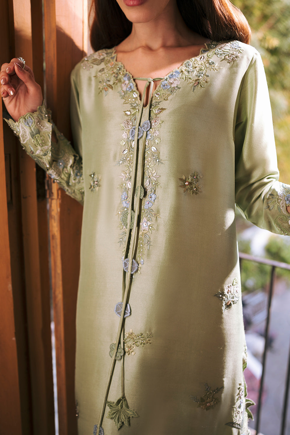 Zona Shaham May mint green outfit — neckline and cuff detail, design reference