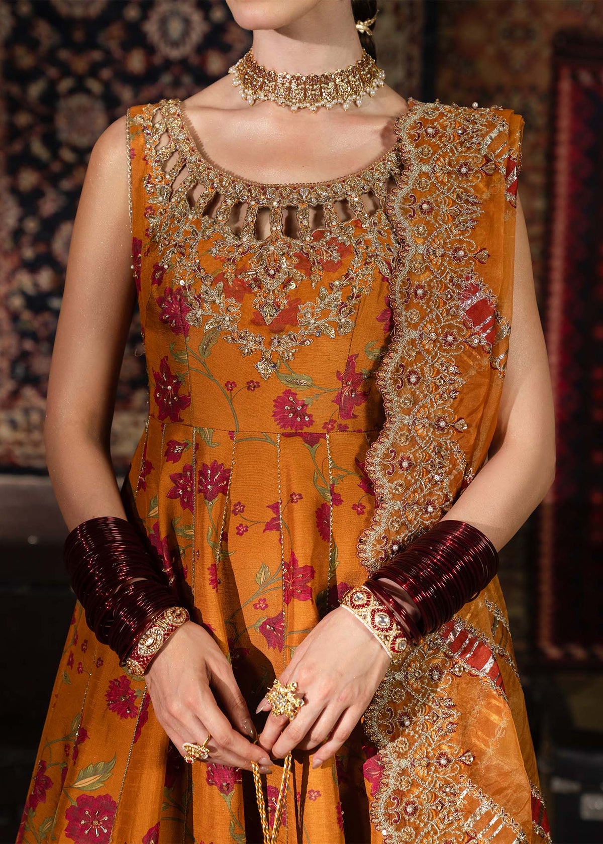 Mehr, made by MAIRAZ — rust pishwas, embroidered neckline close-up