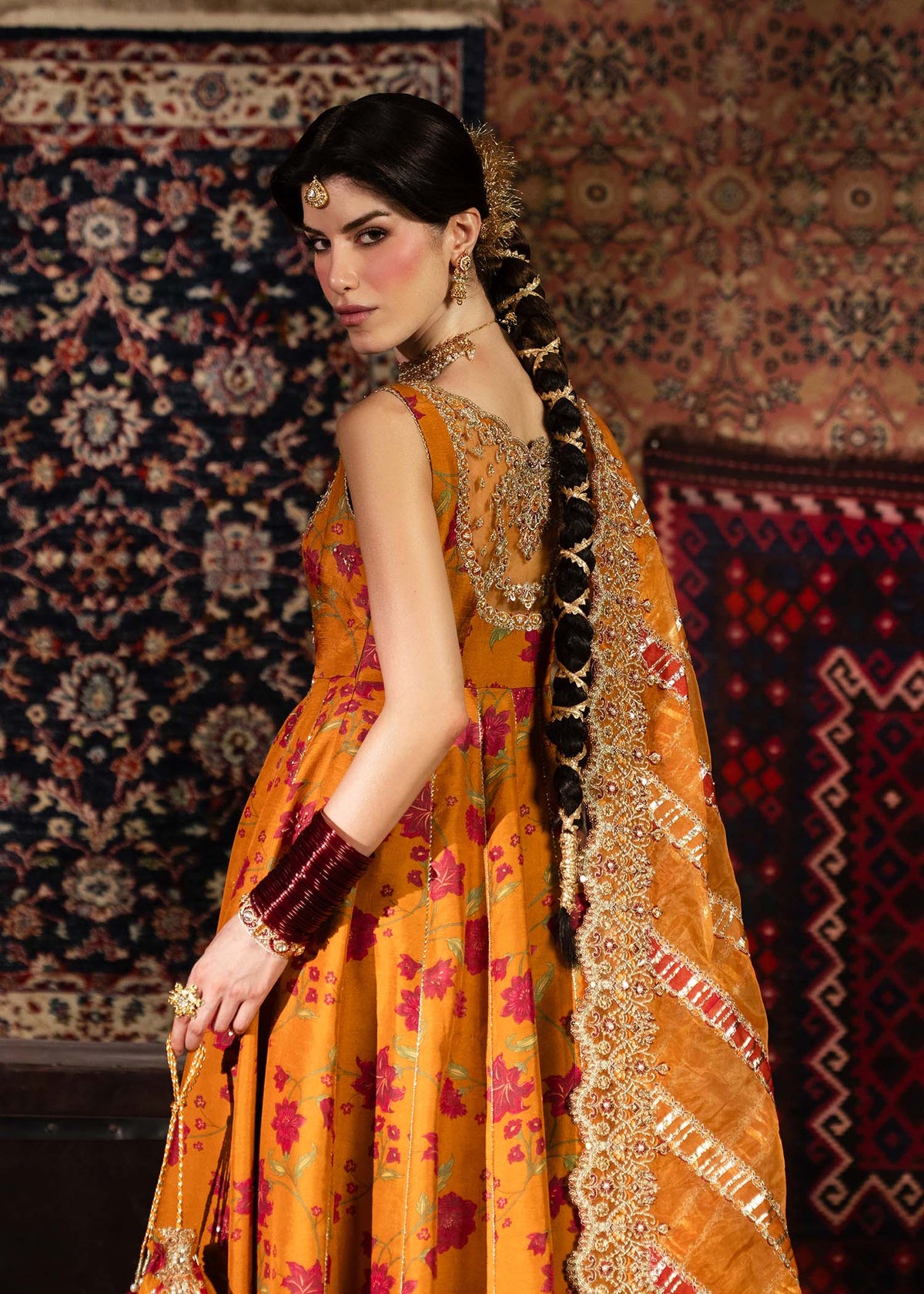 Mehr, made by MAIRAZ — rust pishwas, rear three-quarter view