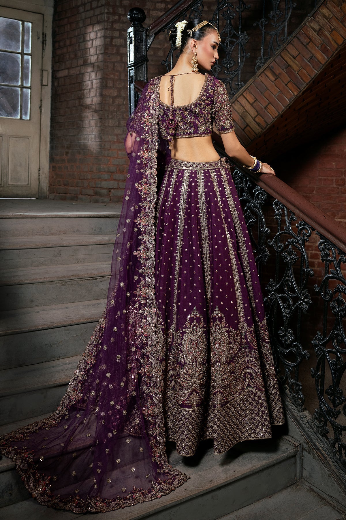 Zarnoor, made by MAIRAZ — deep purple lehenga choli, rear view with dupatta drape
