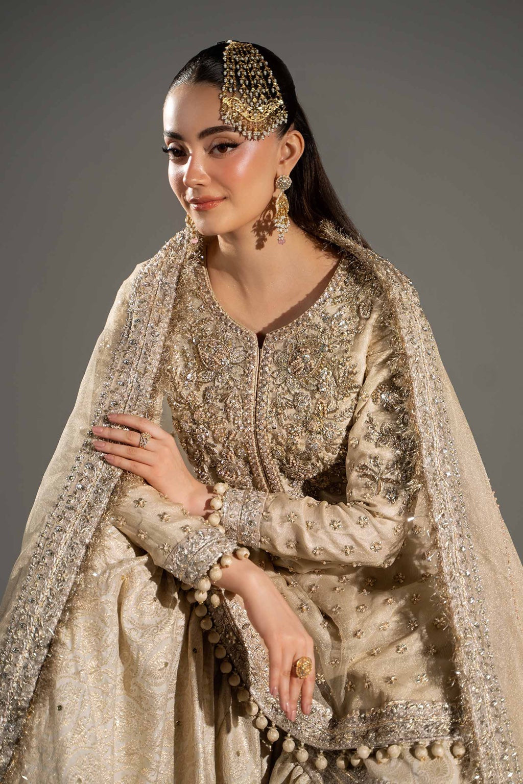 Maria B Mayrozeh Style gold formal outfit seated portrait