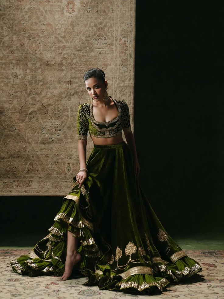 Olive Noor Velvet by MAIRAZ — full-length pose showing the flared lehenga and embroidered hem; design reference