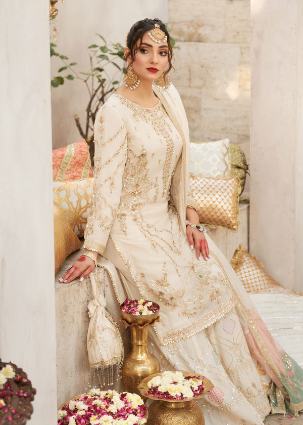 Rafia - RK1256 off-white chiffon ensemble seated side view