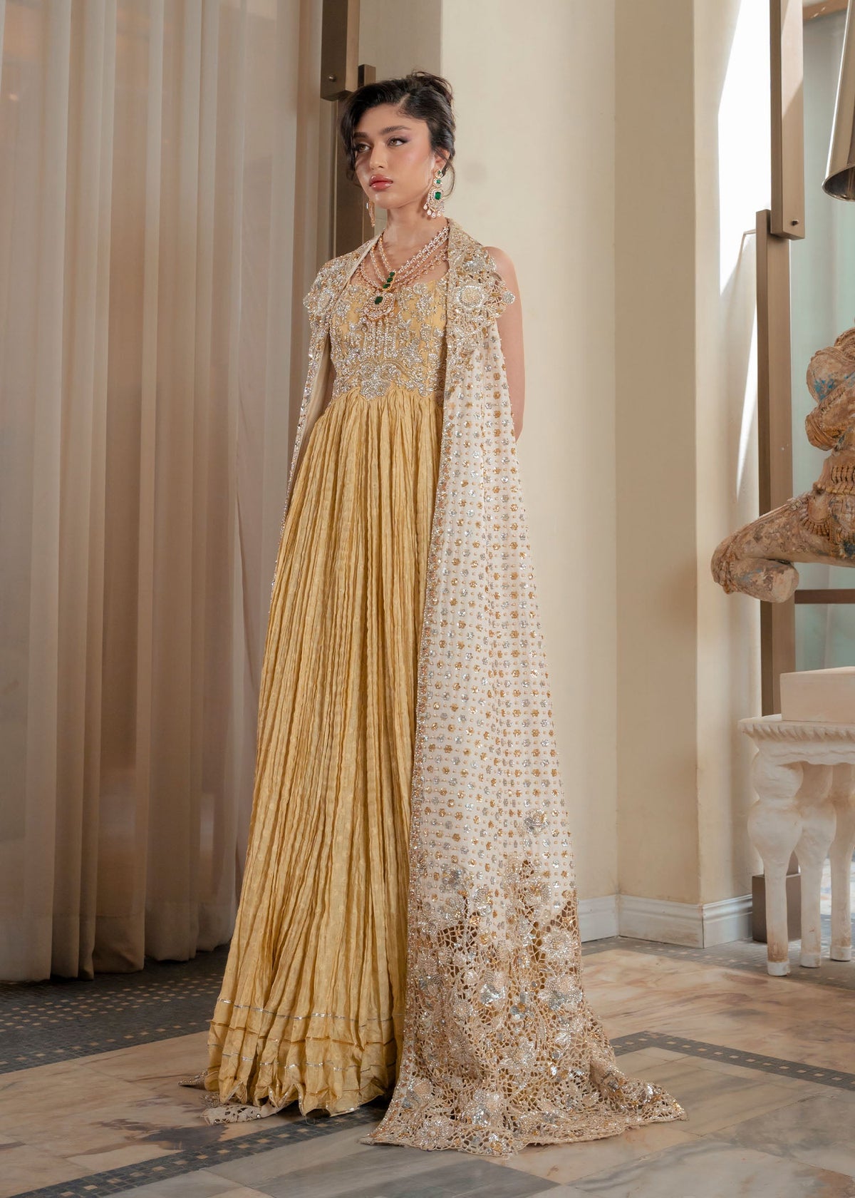 Saira Shakira Lunaire design reference — full-length ivory jacket and lime-yellow underdress