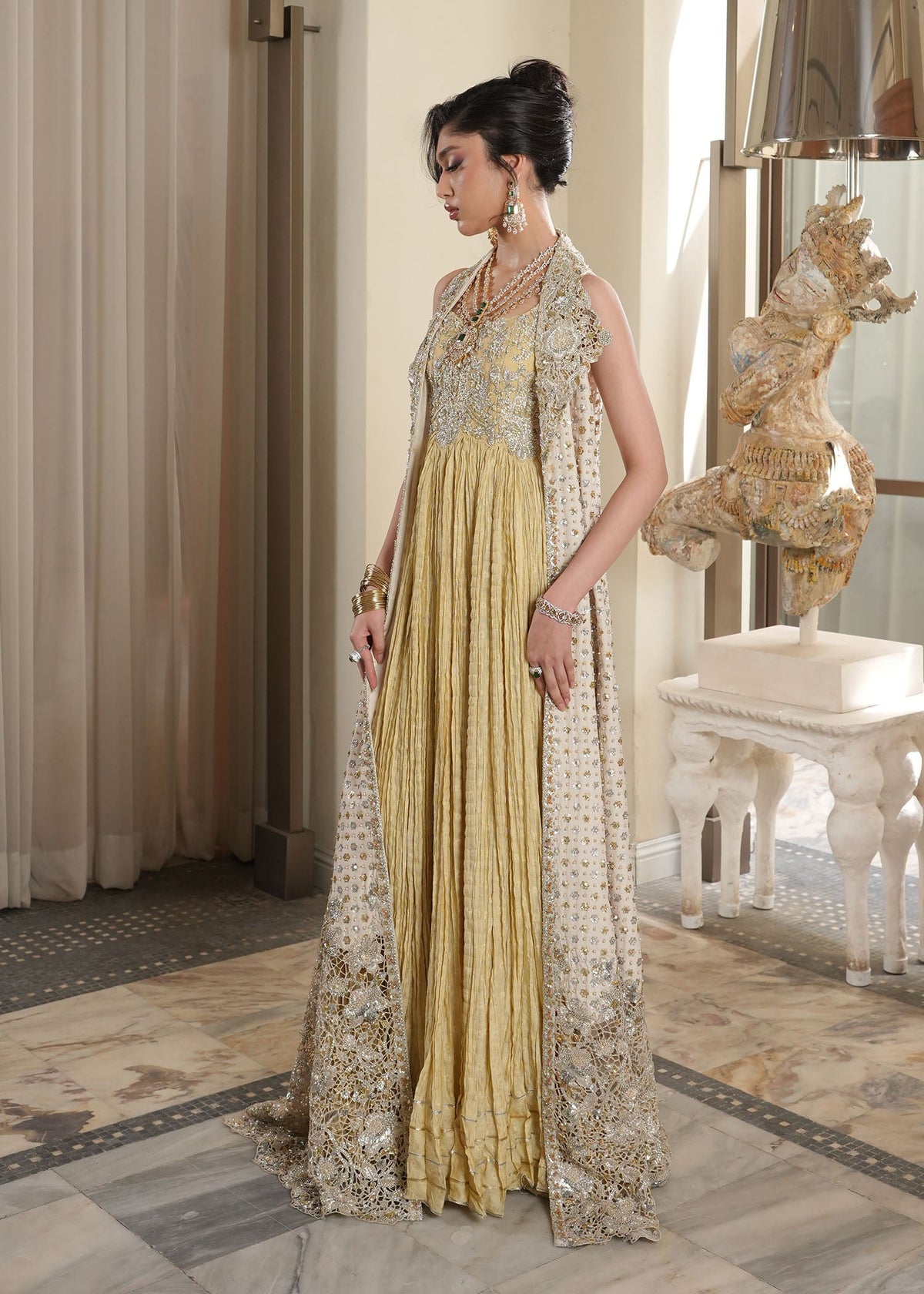Saira Shakira Lunaire design reference — side view of long ivory jacket and cutwork hem