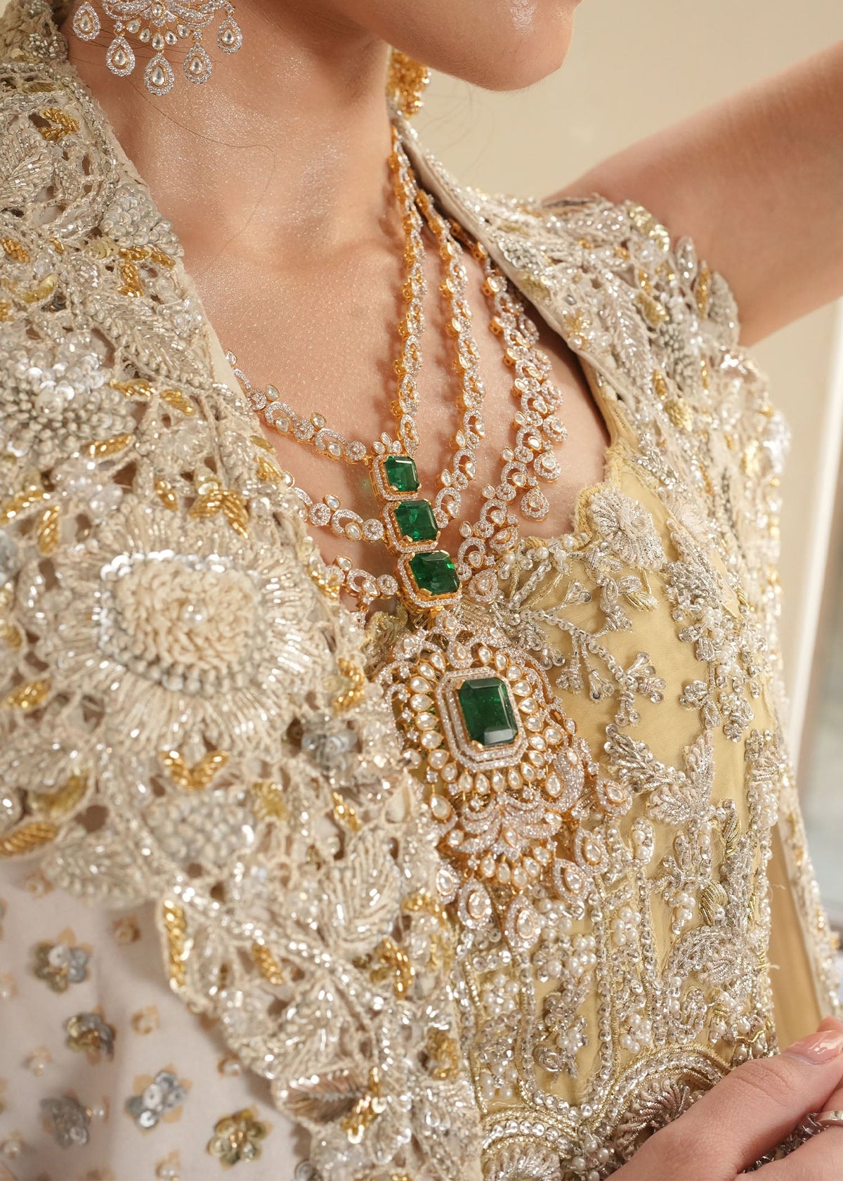 Saira Shakira Lunaire design reference — gold and silver embellishment close-up on bodice and jacket