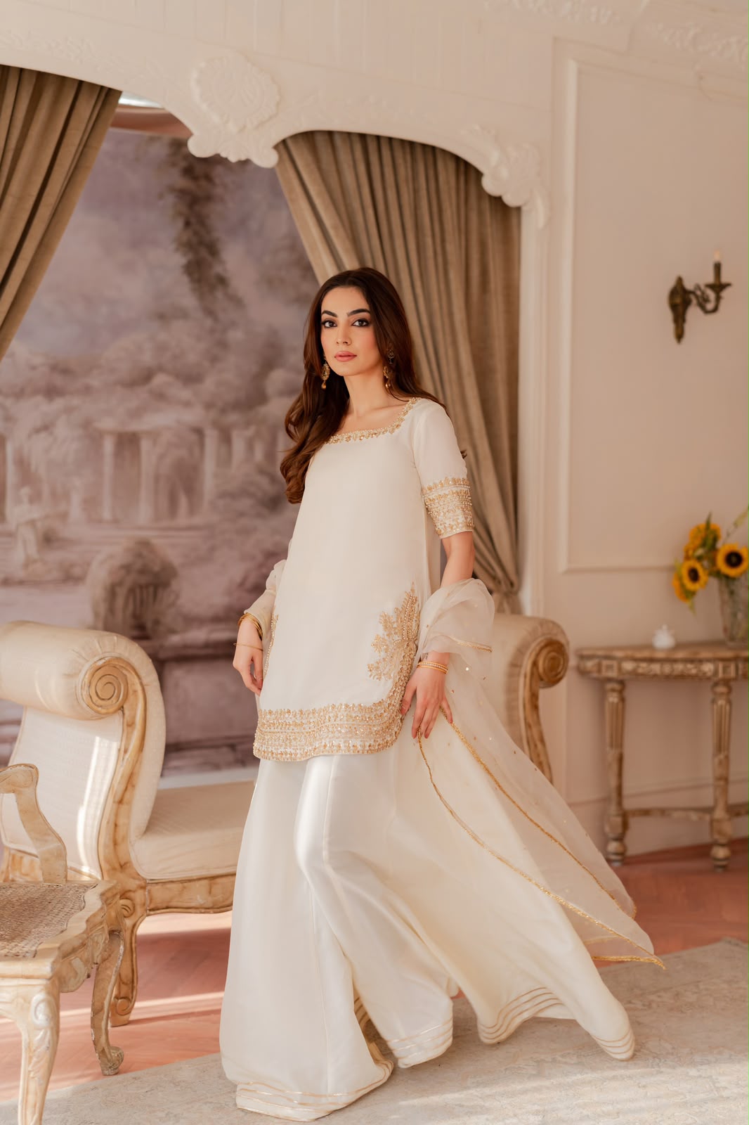 Shanzay & Anooshay White Sharara Style by MAIRAZ — full length front view with gold borders