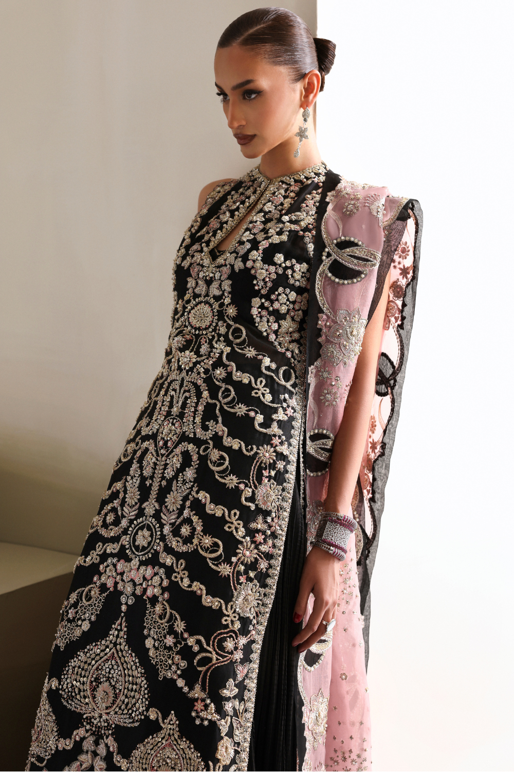 Soraya Myrren reference image — detailed black formal ensemble