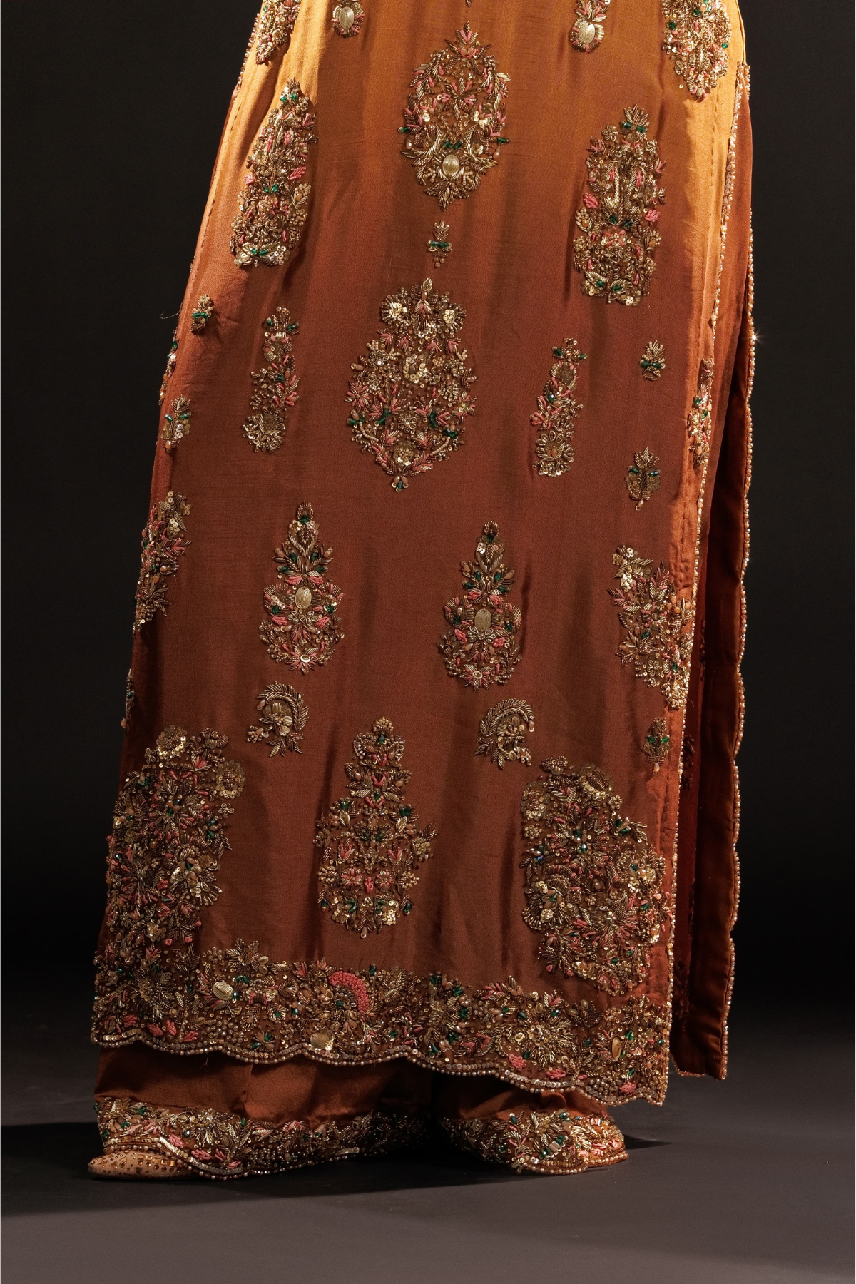 Usama Silk Amber Royale amber-gold formal — hem and trouser detail, source design reference