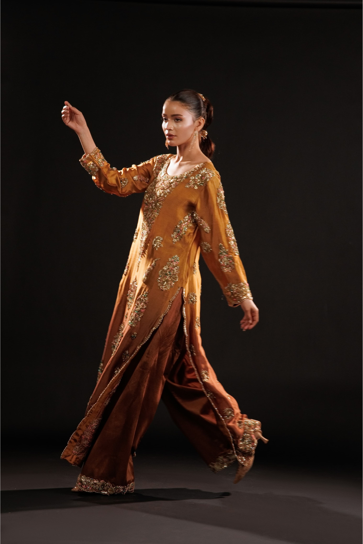 Usama Silk Amber Royale amber-gold formal — movement and side slit, source design reference